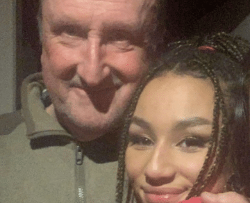 A photo of engineer John with his daughter Fabienne. Both are looking at the camera and smiling.