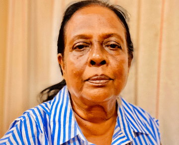 A photograph of Muthukuda (Sarojini) Goonetilleke, looking towards the camera.