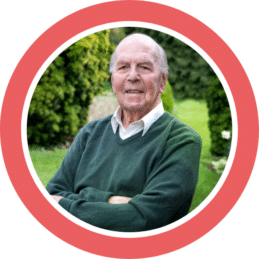 A circle stock photo with a red border showing an old man in a garden, representing community member David who found himself facing an unexpected personal crisis.