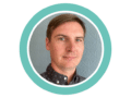 A photo of Jonny Ridge, Head of Fundraising and Communications at Foothold, enclose in a branded Teal ring. Jonny had short brown hair, is looking at the camera and is slightly smiling.