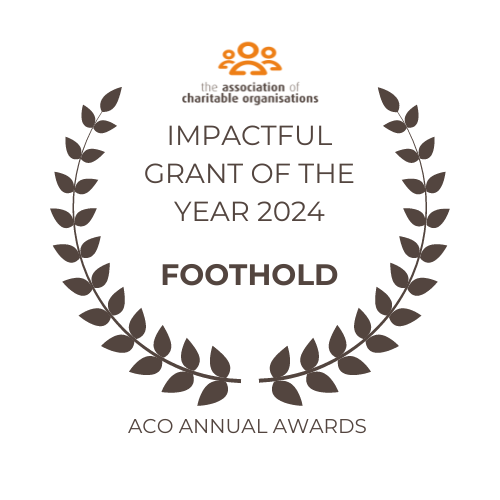 ACO Logo with wreath pattern wrapped around text saying that Foothold won the Impactful Grant of the Year 2024