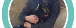 A photo of Tristan on the sofa with his dog