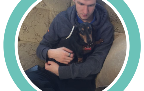 A photo of Tristan on the sofa with his dog