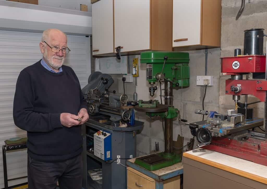 John, a REMAP volunteer, works on a project