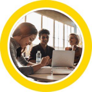 Engineering students laughing together at a table
