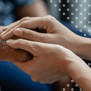 Two people holding hands